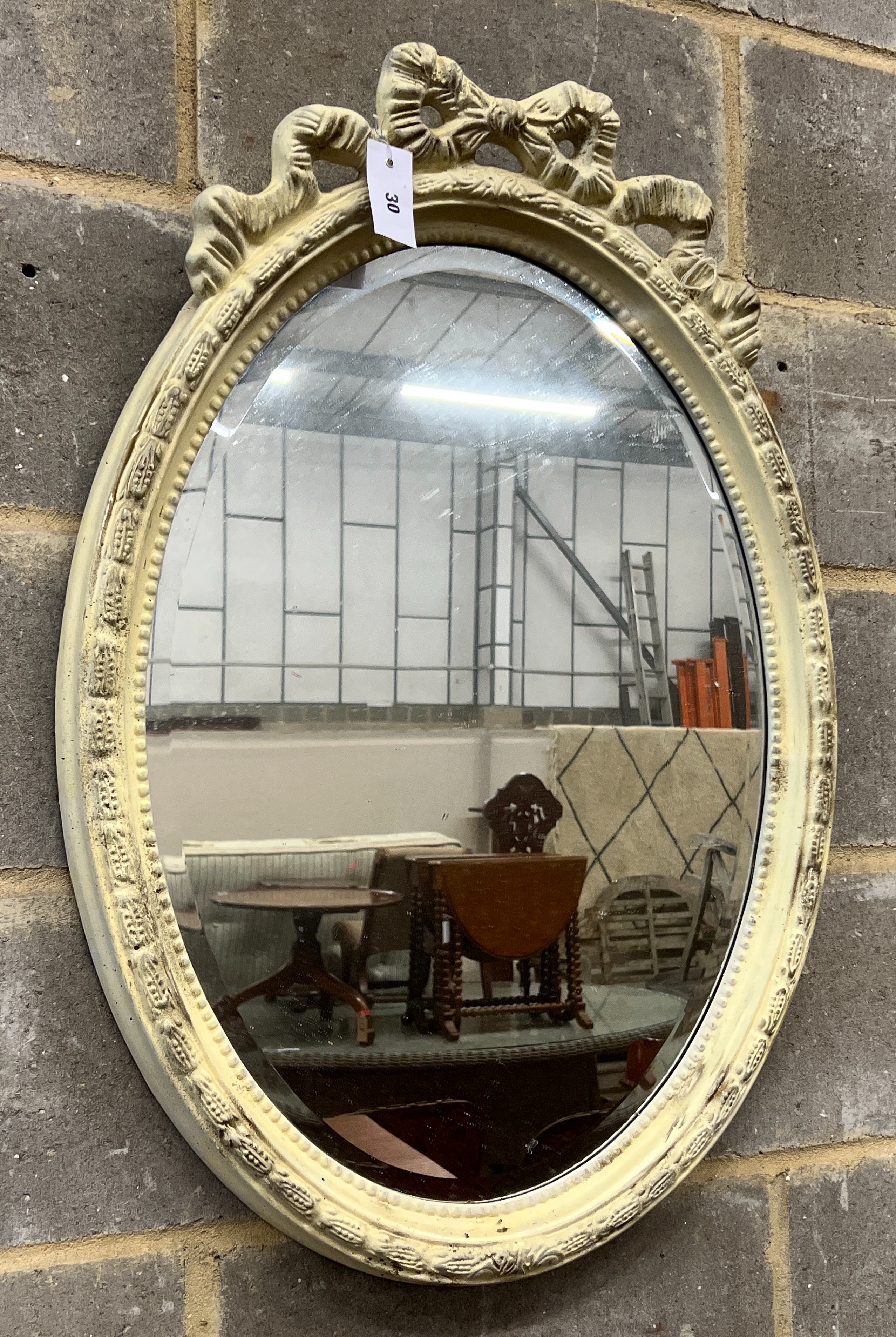 A Victorian style oval painted wall mirror, width 58cm, height 84cm